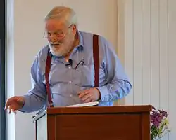 Longley reading his poetry in 2012