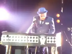 Barson performing live with Madness at Manchester Arena in 2014