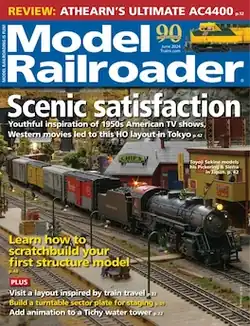 Cover of Model Railroader magazine showing a freight steam model train