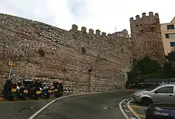 Part of the Moorish city wall with a tower en bec, topped with merlons