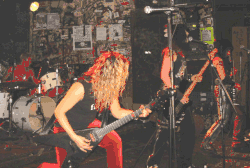 The Motorpsychos performing at CBGB, 2004 (L-R: Dennis Brown, Abby Krizner, Amy Bianco, Pamela Simmons)