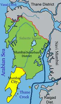 Bombay is on a narrow peninsula on the southwest of Salsette Island, which lies between the Arabian Sea to the west, Thane Creek to the east, and Vasai Creek to the north. Bombay's suburban district occupies most of the island. Navi Mumbai is east of Thane Creek, and the Thane District is north of Vasai Creek.