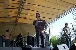 Four men performing onstage