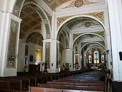 The massive arcades and columns inside the cathedral, designed to counter the effects of earthquakes