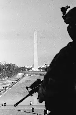 Image 23Black-and-white photograph of a National Guardsman looking over the Washington Monument in Washington D.C., on January 21, 2021, the day after the inauguration of Joe Biden as the 46th president of the United States (from Photojournalism)