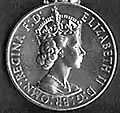 Elizabeth II (1st type); inscription has Br omn (Latin for 'of all the Britains') (1952–1958)