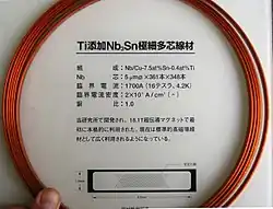 Nb/Cu–7.5at%Sn–0.4at%Ti tape (9.5×1.8&nbsp;mm cross section) originally developed for an 18.1&nbsp;T magnet. Nb core: 361×348 packs of 5&nbsp;μm dia. filaments. Critical current 1700&nbsp;A (16 tesla, 4.2&nbsp;K), critical current density 20&nbsp;kA/cm2