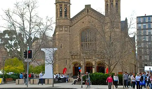 This is a photograph of students from the two neighbouring universities near Bonython Hall on North Terrace.