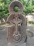 Khachkar in the shape of letter Ց