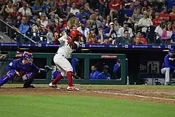 Odubel Herrera follows through on a swing in a game against the New York Mets