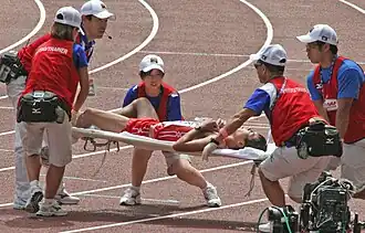 Japanese athlete is carried away after the 50&nbsp;km walk.