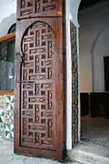 Inner door opening carved with geometric motifs.