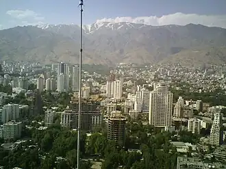 A view of the towers in Elahieh with the Alborz mountain range in the background