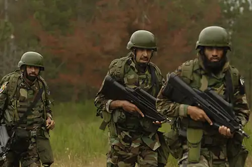 Members of the Special Service Wing (Pakistani Air Force) armed with F2000 rifles during a training exercise at Fort Lewis, Washington, US, July 23, 2007.