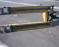 Underside of a jack showing linkages under forks