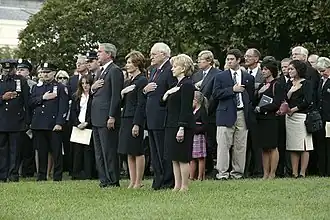 President George W. Bush and Vice President Dick Cheney lead a moment of silence on the South Lawn on September 11, 2004, with White House staff and families of victims of 9/11.