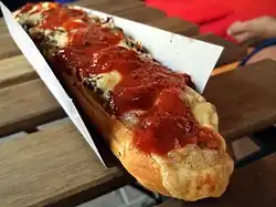 Zapiekanka served on a paper tray