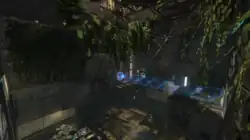 An overgrown testing chamber, with two platforms on the left and right.