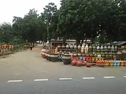 Pots displayed along the Trans–West African Coastal Highway at Vume