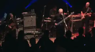 Producers performing at ACM, Guildford in 2012 (L-R: Lol Creme, Ash Soan (drums), Trevor Horn and Steve Lipson