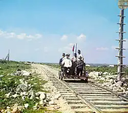 Handcar riding along the Murmansk railroad, on the shore of Lake Onega. (circa&nbsp;1916)