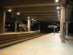 The Putrajaya/Cyberjaya ERL station platform at night.