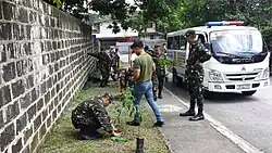 Personnel of the 1st QC TASU conduct treeplanting CMO at Bgy UP Village.