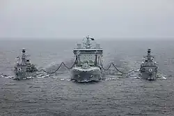RFA&nbsp;Tiderace conducting a dual RAS with two Royal Navy frigates