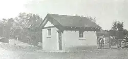 The small barn next to a horse corral (1930s).