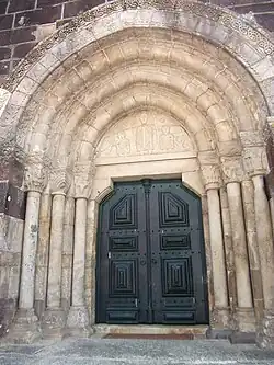 Portal of São Cristóvão de Rio Mau with anthropomorphic and vegetalist motifs.