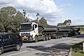 Tri-axle prime mover with quad-axle trailers and tri-axle dolly in Australia