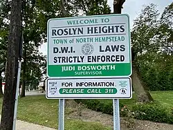 A Roslyn Heights welcome sign on Mineola Avenue in 2020