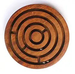 Image 18A ball-in-a-maze puzzle (from List of wooden toys)