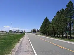 Looking west down Highway 94, Pikes Peak is in the distance