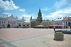 Market Square in Sanok – view of the eastern and southern frontages, including the old town hall and Franciscan monastery