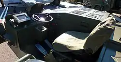 The driving station with the auxiliary power unit to the right.