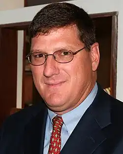 Scott Ritter wearing a suit