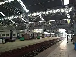 The large shaded 'suburban train only' platform area since British era with some both side platforms