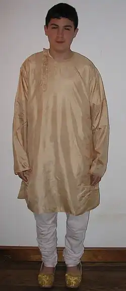 Cotton churidar worn with silk side-opening kurta and mojari shoes