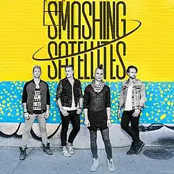 Smashing Satellites members in a August 2015 promo.