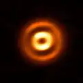 By observing dusty protoplanetary discs, scientists investigate the first steps of planet formation.[25]