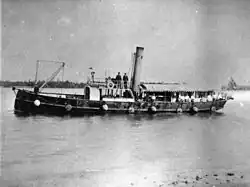 Submarine minefield service vessel "Miner" with spherical mines and connecting cables hanging over side[gallery 6]