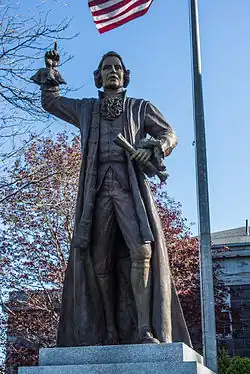 Bronze sculpture of James Otis, Jr stands to the left of the courthouse entrance