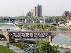 In 1963 two of the arches were replaced with a moveable truss so barges could pass through the new lock.