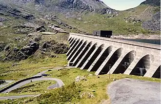 The upper reservoir and dam of the Ffestiniog Pumped Storage Scheme in Wales. The lower power station can generate 360&nbsp;MW of electricity.
