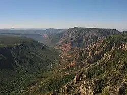 North aspect of Wilson Mountain to right of center, with Oak Creek Canyon below.