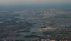 Aerial view across the mouth of the river as it reaches in Port Jackson