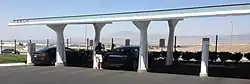 Tesla supercharger rapid charging station, California. The stationary solar arrays are on top.