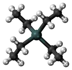A gray-green sphere linked to four black spheres, each, in turn, linked also to three white ones