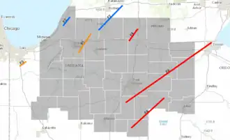 Blue, orange, and red lines superimposed on grey background